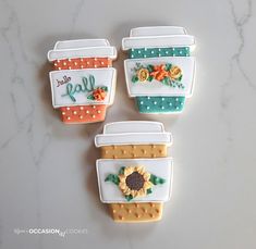 three decorated cookies with the words hello fall written in frosting and sunflowers