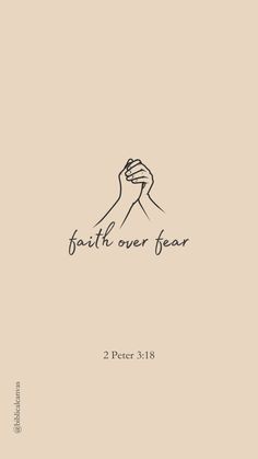 a hand holding the word faith over fear