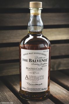 a bottle of the balvenie peael cask 47 years old on a wooden table