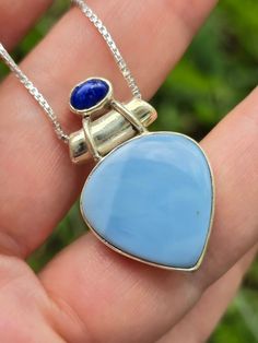 "💥 💥 💥 Natural Owyhee Opal and Lapis Lazuli  pendant in 925 sterling silver.  🌸  Please note that I will include 18\" or 20\" chain with your purchase I currently have available(not the exact chain from the photo).  🌸 --Pendant, including bail: 1.22\" x 0.74\" inches/31 mm x 19 mm 💥 All photos are  enlarged to better view the detailing of every item, please always check the measurements." Blue Pendant Necklace Stamped 925, Blue Pendant Necklace With Sterling Silver Clasp, Blue Spiritual Sterling Silver Necklaces, Blue Hallmarked Spiritual Necklaces, Blue Necklace With Sterling Silver Clasp For Gifts, Blue Pendant Necklace, Lapis Lazuli Pendant, Photo Pendant, Blue Pendant