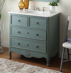 a bathroom vanity with two sinks and a chair in front of the sink, next to a window