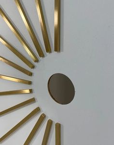 a white ceiling with gold lines and a round hole in the middle that has been cut into smaller pieces