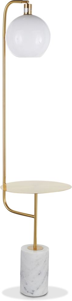 the marble and brass table lamp is shown with an oval white marble base, which has a gold - plated metal arm