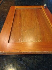 an empty wooden tray sitting on top of a counter