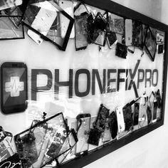 the phone fix pro sign is covered in many different pictures and frames on it's wall