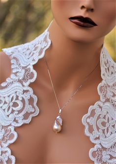 Luxury Teardrop Bridal Necklace Gift, Luxury Bridal Teardrop Necklace Gift, Elegant Iridescent Necklace For Parties, Luxury Drop Pearl Necklace For Gift, Luxury Silver Teardrop Pearl Necklace, Elegant Pear-shaped Bridal Necklace Gift, Elegant High Luster Necklaces For Weddings, Elegant Teardrop High Luster Pearl Necklace, Elegant Teardrop Pearl Necklace With High Luster