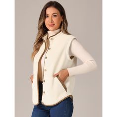 The fall/winter fleece vest for women features a contrasting color design that is both stylish and comfortable. This vest includes a round collar, buttons, suede trim, and two pockets. It is suitable for various occasions such as daily leisure, office, party, and travel. This vest is designed to keep you warm and cozy during the colder months. This vest is perfect for layering over your favorite tops and can be paired with trousers or jeans for a complete look. The contrasting colors add a uniqu Women's Vests, Vest With Pockets, Fall Vest, Vest For Women, Jacket Vest, Vest Fashion, Fleece Vest, Down Vest, Womens Fleece