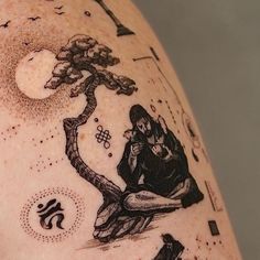 a man with a tattoo on his arm has a tree and birds in the sky