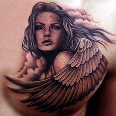 a woman's chest with an angel tattoo design on the top and bottom half