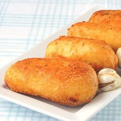 three pieces of bread on a plate with garlic