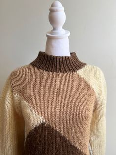 Vintage acrylic ski sweater Diagonal graphic knit pattern Mid collar Cream, tan and chocolate brown Super soft and classic Size Men's Small Shoulder to shoulder 17" Chest 38" Length 25" Sleeve 23" Retro Brown Knit Sweater, Brown Retro Knit Sweater, Retro Brown Crew Neck Sweater, Fitted Brown Crew Neck Sweater, Retro Beige Knitted Sweater, Beige Knitted Retro Sweater, Cream Retro Winter Sweater, Cozy Fitted Brown Sweater, Retro Brown Knitted Sweater