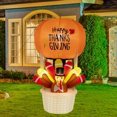 an inflatable thanksgiving turkey balloon with the words happy thanks giving written on it