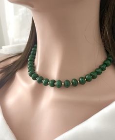 Gorgeous Chunky Green  Jade Necklace in 14K Goldfilled .Matching Earrings included . The Deep Green Color definitely makes it a a style statement !  Very Similar to a Faceted Emerald necklace !  Jade Beads : Goldfilled Lobster Clasp Green Jade Beads : 5 - 12 mm Necklace length : 18 inches + 1.00 inches Jade has long been considered to be a lucky stone, especially by the peoples of Southeast Asia. The spiritual meaning of Jade is longevity and wisdom. It is believed to facilitate access to the spiritual realms, provide protection against negative energies and entities, and also to enhance our creativity and imagination Cheap Polished Jade Beaded Necklace, Traditional Green Beaded Necklaces, Cheap, Luxury Jade Beaded Necklace With Gemstone Beads, Cheap Polished Bead Jade Necklaces, Green Jade Necklace, Green Beads Necklace, Jade Bead Necklace, Necklace Outfit, Tibetan Jewelry