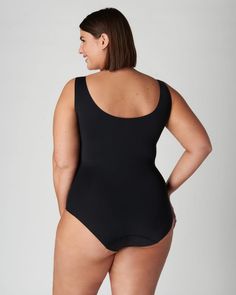 A sleeveless plus size top to transform your workwear and everyday outfits Compressive Full Coverage Seamless Bodysuit, Black Second-skin Bodysuit With Built-in Bra, Sleek Black Leotard With Built-in Bra, Sleek Black Bodysuit With Smoothing Detail, Black Seamless Full Coverage Bodysuit, Black Second-skin Full Coverage Swimwear, Black Tight-fitting Sleek Bodysuit, Sleek Second-skin Black Bodysuit, Sleek Black Second-skin Bodysuit