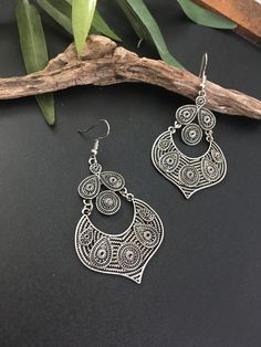 Indus Earrings : Back to our Roots. For the women who makes a statement.  An exclusive shop for earrings. Wear them with pride.  These are dangling drops style earrings . An unique handmade Indian style ethnic bohemian/ Tribal earrings in silver shade.  These earrings are made from high quality Tatanium / German silver material  which are hypoallergenic and free from corrosion & rusting.  Notes : The product shipped will be same as shown in the picture, however the actual colours may vary slightly due to the natural lighting in the photography. We do not accept returns or refunds , however in case of any issues we will definitely try and resolve it. Teardrop Chandelier Earrings For Festival, Nickel-free Bohemian Chandelier Earrings, Bohemian Chandelier Earrings With Ear Wire For Festivals, Bohemian Drop Earrings, Bohemian Teardrop Danglers For Gifts, Silver Teardrop Chandelier Earrings For Festivals, Traditional Nickel-free Teardrop Earrings, Festival Silver Teardrop Chandelier Earrings, Handmade Metal Teardrop Earrings