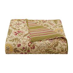 an image of a comforter set with flowers and stripes on the bed coverlet