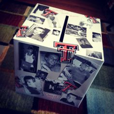 a refrigerator covered in pictures and magnets sitting on top of a carpeted floor