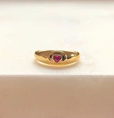 "\"Be Mine\" Dainty Pink Heart Stone Signet Ring with Ruby Cubic Zirconia Crystal. This ring shouts LOVE and PASSION in the most subtle way possible!💞 So simple and sensual ✨The PERFECT dainty LOVE Ring! Ways to Wear: Pinky finger and Index finger💞 Ruby Represents: Love, Energy, Passion, Power, and Zest of Life💖 Handmade Item 💕😊 ENJOY ! Material 18K-Gold Plated over Solid Sterling Silver Gemstone: Cubic Zirconia Lead & Nickel free Details Ruby Cubic zirconia (Red/Pink) Diamond cut stone Heart Shaped Signet Ring For Valentine's Day, Elegant Heart-shaped Signet Ring In 14k Gold, 14k Gold Heart-shaped Signet Ring Gift, Valentine's Day Heart-shaped 14k Gold Signet Ring, Heart-shaped Yellow Gold Signet Ring For Valentine's Day, Ring With Ruby, Pinky Finger, Ruby Heart, Heart Padlocks