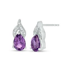 Appeal to her sophisticated taste with these exciting gemstone drop earrings. Created in sterling silver, each graceful earring showcases a 7.0 x 5.0mm pear-shaped bright purple amethyst beneath a flame-inspired design of overlapping ribbons adorned with sparkling diamond accents and beaded detailing. Buffed to a brilliant luster, these post earrings secure comfortably with friction backs. Elegant Gemstone Teardrop Earrings For Anniversary, Elegant Amethyst Drop Earrings, Formal Teardrop Gemstone Diamond Earrings, Pear-shaped Gemstone Teardrop Earrings For Anniversary, Formal Teardrop Amethyst Earrings, Formal Amethyst Teardrop Earrings, White Gold Teardrop Gemstone Diamond Earrings, White Gold Teardrop Gemstone Earrings, Sterling Silver Gemstone Teardrop Pendant Earrings