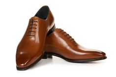 Made from a single piece of Italian calfskin leather, this gorgeous wholecut oxford has a sleek profile that's guaranteed to turn heads. Runs full size large (order full size down from regular US dress shoe size). For example, if you normally wear a size US 10 dress shoe, order a size 9 Alternatively, order one and a half sizes below your Brannock device measurement. For example, if you measure a 10 on the Brannock, order a size 8.5 Full-grain Italian calfskin leather upper Matching leather sole Classic Cognac Plain Toe Oxfords, Formal Cognac Oxfords, Cognac Leather-lined Oxfords For Business, Luxury Cognac Oxfords For Semi-formal Occasions, Cognac Shoes, Semi-formal Leather Oxfords In Cognac, Paul Evans, Single Piece, Cognac