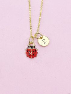 This is an alloy red ladybug charm with hand stamped initial charm on a stainless-steel or brass chain. ♥ You will receive 1 necklace. HOW TO ORDER 1) Select the quantity 2) Select the stamp and finish. 3) Add to cart DESCRIPTION ♥ Necklace, Stainless Steel or Brass Cable Chain 18 inches, Nickel Safe. ♥ Initial Charms, Stainless steel, Size: about 8-10mm in diameter, 1mm thick, Nickel Safe, ♥ Alloy Enamel Charms, 3D Ladybug Charms, Golden, Size: about 0.35 inch(9mm) wide, 0.49 inch(12.5mm) long, Red Pendant Charm Necklace, Cute Charms With Lobster Clasp For Gift, Dainty Charms With Lobster Clasp For Gifts, Red Dangle Charm Necklaces, Tiny Round Pendant Charm Necklaces For Gift, Tiny Round Pendant Charm Necklaces As Gift, Small Charm Necklaces For Gifts, Gift Tiny Round Pendant Charm Necklaces, Personalized Novelty Pendant Jewelry