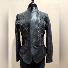 Reba Size Small, Lambskin Leather, Black, Studded, Peplum Jacket. Nwot Slant Full Zipper, Zipper Cuffs. Leopard Print Satin Lining. No Pockets. On Front Grommets, Studs, And Rope Decor. Extremely Soft. Measures 19 1/2" Across Armpit To Armpit Full Length 21 1/2" Sleeve 23" Leather Jacket With Rivets Long Sleeve, Leather Jacket With Rivets, Fitted Winter Leather Jacket With Rivets, Fitted Leather Jacket With Rivets For Winter, Fitted Black Leather Jacket With Rivets, Elegant Leather Jacket For Night Out, Fitted Outerwear With Rivets For Fall, Elegant Leather Biker Jacket For Night Out, Fitted Elegant Biker Jacket For Night Out