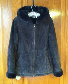 "Vintage beautiful 90s faux fur lined leather suede winter hooded jacket by Croft and Barrow in excellent condition.  I can not find any signs of wear.  Lining is also in perfect condition or no signs of wear.  Good zipper.  2 outside pockets.  Super warm. Maker: Croft and Barrow Color: chocolate brown Size women's medium  Measurements taken with jacket laying flat. Shoulders:  18\" Armpit to armpit:  22 1/2\" Sleeves:  25\" Waist:  19\" Hips or bottom of jacket:  22 Length:  27\" 100% polyester lining 100%. Leather suede Free domestic shipping!" Brown Hooded Fur Coat With Faux Fur Lining, Brown Hooded Jacket With Faux Fur Lining For Fall, Hooded Leather Outerwear With Faux Fur Lining, Hooded Leather Jacket With Fleece Lining For Fall, Winter Hooded Leather Jacket With Faux Fur Lining, Hooded Leather Jacket With Fleece Lining For Winter, Hooded Leather Jacket With Faux Fur Lining For Winter, Winter Leather Jacket With Faux Fur Lining And Hood, Hooded Leather Jacket With Faux Fur Trim For Fall