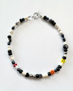 "Necklace beaded by me with luuvvvv <3 Will look very similar to photos. Has all different sizes of black and white freshwater pearls, that will vary due to natural variation. Circle toggle clasp closure, all necklace will have orange & yellow smiley face, red mushroom, 8ball, yin yang and dice.  Necklace in photos is 18\"." Trendy Black Necklace With Colorful Beads, Black Bohemian Letter Beads, Bohemian Black Letter Beads, Black Beaded Necklace With Letter Beads, Black Beaded Necklace With Letter And Round Beads, Black Necklaces With Round Letter Beads, Casual Black Beaded Necklace With Colorful Beads, Trendy Black Beaded Necklaces With Round Beads, Trendy Black Beaded Necklace Gift