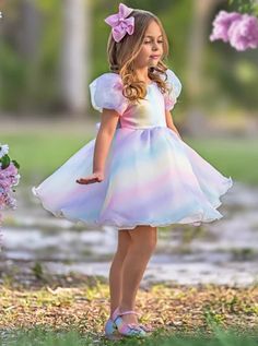 It's like this pastel puff sleeve dress has been sprinkled with fairy dust! Turn your little fashionista into a magical princess on her next special event. An enchanting whirl of colors and a puffy, twirl-ready silhouette will make her the belle of the ball. Voluminous silhouette dances with every step, adding an extra layer of charm to every move. #Robin# Playful Puff Sleeve Summer Dress, Fitted Princess Style Puff Sleeve Dresses, Spring Bubble Dress For Dress-up, Spring Princess Dress With Puff Sleeves For Dress-up, Spring Bubble Dress For Dress-up Occasions, Fitted Multicolor Princess Dress With Ruffles, Fitted Puff Sleeve Dress For Dress-up, Fitted Puff Sleeve Dress With Short Sleeves For Dress-up, Multicolor Princess Dress For Spring Dress-up