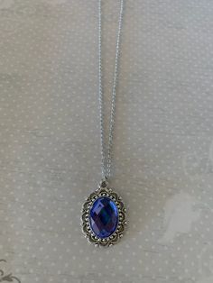 "This pretty oval shaped necklace in tibetan silver and periwinkle blue has an intricately designed edging with a periwinkle blue crystal center stone. Pendant measures 1\" L X 7/8\" W and is on an 18\" chain. ★ Want to see more? Please visit my shop at: https://www.etsy.com/shop/DesignsByPeg" Nickel-free Blue Oval Necklace, Emerald Green Necklace, Green Stone Necklace, Brown Jewelry, Brown Necklace, Periwinkle Blue, Victorian Jewelry, Oval Stone, Stone Pendant