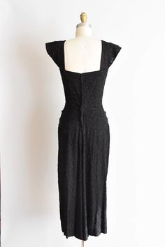 "Stunning Vintage 1950s rayon cocktail dress. Heavily beaded and sequinced . Sweetheart bust, wide shoulder pads, darted bust and nipped waist. Slight fishtail in back. Back metal zipper closure. A lovely work of art! State of garment | excellent. Measurements ✂--- best fit | small bust | 34\" shoulders | not specified shoulder to waist | 17\" shoulder straps | 5 \" waist | 25 -25.5 \" hips | up to 36\" total length (shoulder to hem) | 49 \" ★★Visit The Shop★★ http://www.etsy.com/shop/seaofvinta Vintage Fitted Dress With Sweetheart Neckline For Party, Elegant Fitted Vintage Party Dress, Elegant Fitted Vintage Dress For Party, 1950s Evening Dress With Lined Bodice, Fitted 1950s Style Evening Dress, Vintage Fitted Evening Dress With Sweetheart Neckline, 1950s Style Sleeveless Evening Dresses, Fitted Vintage Dress With Sweetheart Neckline For Evening, Fitted 1950s Style Vintage Evening Dress