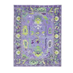 a purple and green rug with an ornate design on the center, in front of a white background