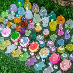 there are many small plastic toys on the grass