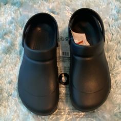 Brand New With Tags/Original Packaging. Never Worn. Fit Big. Black Non-slip Flat Clogs, Black Flat Synthetic Clogs, Black Synthetic Flat Clogs, Flat Black Synthetic Clogs, Black Flat Clogs With Cushioned Footbed, Black Fade-resistant Clogs For Work, Comfortable Slip-resistant Black Clogs, Comfortable Black Slip-resistant Clogs, Comfortable Black Clogs With Round Toe