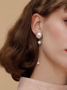 These earrings feature a sophisticated design with a combination of long and small beads delicately wrapped together. Crafted with precision and attention to detail, these studs exude elegance and charm. Versatile enough to complement both casual and formal attire, they add a touch of refined beauty to any ensemble. Metal: 14K Gold Filled Gemstone: Freshwater Pearl Length Diameter: 75m Main Pearl Diameter: 17mm(including metal parts) Edison Pearls, Ear Clips, Small Beads, Tiger Eye Stone, Sophisticated Design, Formal Attire, Ring Bracelet, Stone Necklace, Stone Rings