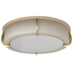 a white and gold circular light fixture