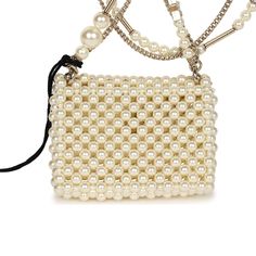 This Chanel flap bag pendant necklace is made of pearls with light gold tone hardware and features a front flap with signature CC magnetic closure, and a light gold tone chain link with pearl, CC pendants, and star pendants.Collection: 23AOrigin: FranceCondition: New and never wornAccompanied by: Chanel pouch, retail UPC and carebookMeasurements: 2" x 1.75" pendant; 23.5" chain length Evening Pearl Necklace, Evening Pearl Necklace With Pearl Chain, Evening Pearl White Pearl Necklace, Elegant Pearl Necklace With Chain For Evening, Luxury Pearl Necklace With Chain, Luxury Pearl Necklace For Evening, Chic Pearl Necklace With Chain For Formal Events, Chic Formal Pearl Necklace With Chain, Chic Pearl Necklace With Chain For Formal Occasions