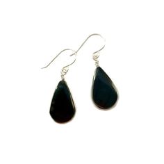 These black stone earrings include two genuine Obsidian stones from Peru dangling beneath a feminine French ear wire. The black, teardrop shaped semiprecious gemstones have a grooved edge in which the premium quality metal wire is wrapped. Choose your finish: 925 Sterling Silver or 14K gold fill.The wirework is handwoven in my art jewelry studio on the beautiful island of Martha's Vineyard. The earrings are approximately 1.25 inches long as measured from the center of the French ear loop to the Black Drop Earrings For Gift, Black Teardrop Earrings As Gift, Nickel Free Black Long Drop Earrings, Classic Black Drop Jewelry, Black Teardrop Jewelry For Everyday, Classic Handmade Black Earrings, Black Teardrop Earrings With Ear Wire For Gift, Modern Black Drop Earrings, Black Sterling Silver Long Drop Jewelry