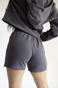 IDEAL FOR: Made from our customized high-quality cozy up fabric blend, these sweat shorts offer exceptional comfort, making them ideal for relaxed, everyday wear.Whether you're enjoying a lazy Sunday, running errands, or working from home, our Women's Sweat shorts are designed to keep you feeling relaxed and looking stylish. FEELS LIKE: The Coziest feeling ever! WHY WE LOVE THEM: Elevate your comfort and style with these sweat shorts, the perfect match for our Cozy Up Hoodie. EXTRAS: Crafted with your comfort in mind, these sweat shorts are designed to provide a cozy and stylish loungewear experience. Lounging Bottoms With Built-in Shorts, Activewear With Built-in Shorts For Relaxation, Solid Cotton Pajama Shorts In Athleisure Style, Gray Loungewear Activewear With Side Pockets, Gray Activewear With Side Pockets For Loungewear, Comfy Activewear With Side Pockets For Loungewear, Relaxed Fit Athletic Shorts With Ribbed Waistband, Comfy Cotton Activewear, Comfortable Loungewear Activewear With Side Pockets