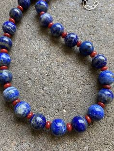 Sterling Silver Round Lapis Coral Bead Necklace. 18 inch Formal Lapis Lazuli Necklace With Round Beads, Formal Lapis Lazuli Beaded Necklace, Round Lapis Lazuli Necklace With Natural Stones, Lapis Lazuli Necklaces With Natural Stones, Lapis Lazuli Natural Stones Round Necklace, Single Strand Lapis Lazuli Round Bead Jewelry, Single Strand Lapis Lazuli Necklace, Lapis Lazuli Gemstone Beads Necklaces, Classic Round Beaded Necklaces As Gift