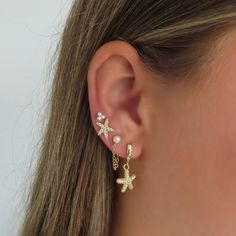 Transform into a starry-eyed mermaid with these Ocean Breeze Earrings. Adorned with dangling pavé starfish on huggie hoops, they'll add a touch of cuteness to any outfit. Starry Eyed, Mermaid Earrings, Ocean Breeze, Starfish, Silver Earrings, Mermaid, Silver