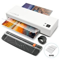 an image of a printer that is being used for printing pictures and other things on the table