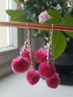 Totally delightful three tiered fluffy pink pom pom drop earrings. Made from pink pom poms and silver plated beads and findings. The length of the earrings is approx 6cm. These little show stoppers are lots of fun and great for any occasion. Will be packaged securely for safe, tracked delivery. Pom Pom Drop, Pink Pom Poms, Pink Pom Pom, Pom Earrings, Pom Pom Earrings, May 17, Handmade Jewellery, Pom Poms, Beautiful Jewelry