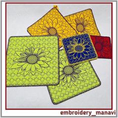 four coasters with flowers on them in yellow, red and blue colors are shown