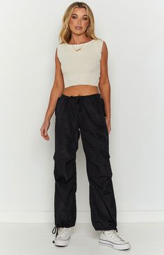 * Black Cargo Pants 
 * Easy and comfy in these black drawcord pants (). Chuck on sneakers () and a crop top () - so effortless yet you're sure to look great! 
 * 
 
 * Light weight with no stretch 
 * Unlined 
 * Loose fit 
 * Drawstring waist 
 * Two front pockets on side 
 * Two back pockets 
 * Drawstring ankles 
 * Non-functional centre front button Relaxed Fit Cropped Bottoms For Streetwear, Casual Cropped Bottoms With Cargo Pockets, Black Cropped Bottoms For Streetwear, Black Cropped Streetwear Bottoms, Casual Cropped Black Bottoms, Sporty Cropped Cotton Bottoms, Cropped Black Streetwear Bottoms, Casual Cropped Pants For Streetwear, Sporty Cropped Bottoms For Streetwear