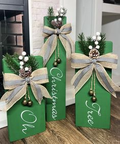 two green boxes with christmas decorations on them