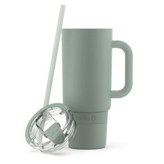 a green cup with a straw and lid next to a glass tumbler that has the lid open