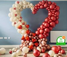 balloons are arranged in the shape of an i love you sign with red and white balls