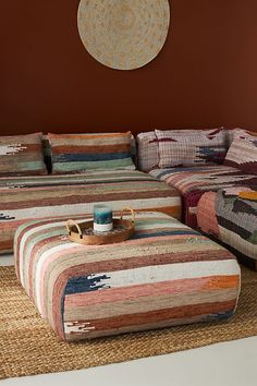 a living room with two couches and a coffee table on the floor in front of it