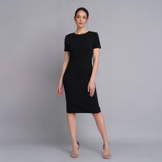 A minimalist dress featuring pencil silhouette, short sleeves, and a midi length. - scoop neck - fitted sheath silhouette - short sleeves - princess seams - midi length - concealed back zipper closure - fully lined The outer fabric : 40% viscose, 55% polyester, 5% elastane. The lining : 57% Viskose, 35% polyester, 8% elastane. Care: cold hand wash with similar colour. Please choose from our measurements chart your dress size, or write us your body measurements, we then select the right size for Midi Dress Short Sleeve, Ruffle Summer Dress, Sheath Midi Dress, Party Dress Wedding, Measurements Chart, Minimalist Dress, Dress Business, Pencil Silhouette, Dress Wedding Guest